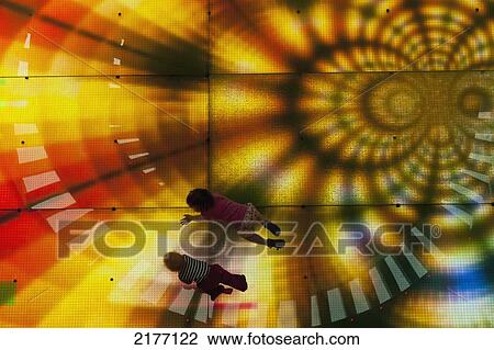 UAE, Dubai Mall shopping centre; Dubai, Looking down on two young children on illuminated LED floor View Large Photo Image Stock Image - UAE, Dubai Mall shopping centre; Dubai, Looking down on two young children on illuminated LED floor. Fotosearch