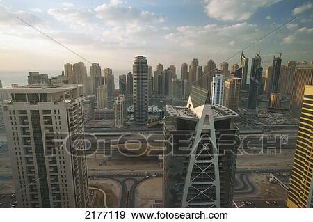 UAE, Dubai Marina; Dubai, Looking out across office and residential tower blocks View Large Photo Image Stock Photo - UAE, Dubai Marina; Dubai, Looking out across office and residential tower blocks. Fotosearch