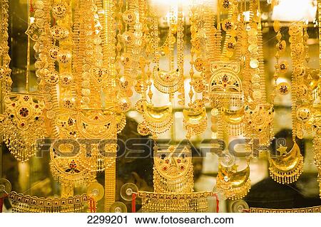 UAE, Gold Souk in Al Ras; Dubai, Shop windows dripping with gold jewelry View Large Photo Image Stock Image - UAE, Gold Souk in Al Ras; Dubai, Shop windows dripping with gold jewelry. Fotosearch