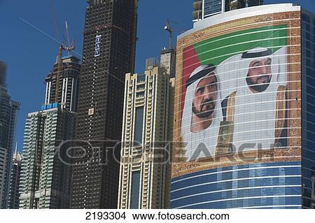 UAE, Large portrait of Sheikh Mohammed Bin Rashid Al Maktoum and Khalifa bin Zayed Al Nahyan on office building; Dubai View Large Photo Image Picture - UAE, Large portrait of Sheikh Mohammed Bin Rashid Al Maktoum and Khalifa bin Zayed Al Nahyan on office building; Dubai. Fotosearch