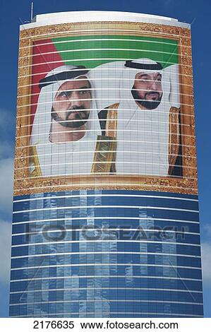 Stock Photography - UAE, Large portrait of Sheikh Mohammed Bin Rashid Al Maktoum and Khalifa bin Zayed Al Nahyan on office building; Dubai. Fotosearch