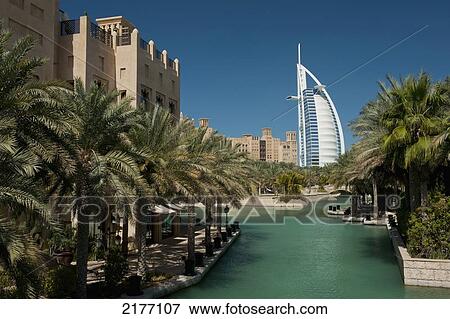 UAE, Madinat Jumeirah Hotel with the Burj Al Arab Hotel behind; Dubai View Large Photo Image Stock Photo - UAE, Madinat Jumeirah Hotel with the Burj Al Arab Hotel behind; Dubai. Fotosearch