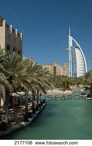 UAE, Madinat Jumeirah Hotel with the Burj Al Arab Hotel behind; Dubai View Large Photo Image Stock Photograph - UAE, Madinat Jumeirah Hotel with the Burj Al Arab Hotel behind; Dubai. Fotosearch