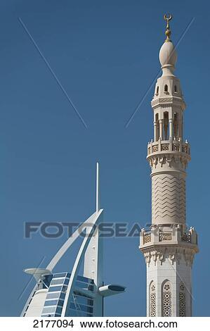UAE, Minaret of small mosque in front of Burj Al Arab hotel; Dubai View Large Photo Image Picture - UAE, Minaret of small mosque in front of Burj Al Arab hotel; Dubai. Fotosearch