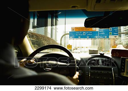 Picture - UAE, out of Dubai towards Abu Dhabi; Dubai, Driving down Sheikh Zayed road. Fotosearch