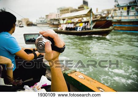 UAE, Tourists Riding Small Ferry and Bustling Waterway Traffic of Dubai Creek; Dubai Creek. Dubai View Large Photo Image Stock Photo - UAE, Tourists Riding Small Ferry and Bustling Waterway Traffic of Dubai Creek; Dubai Creek. Dubai. Fotosearch