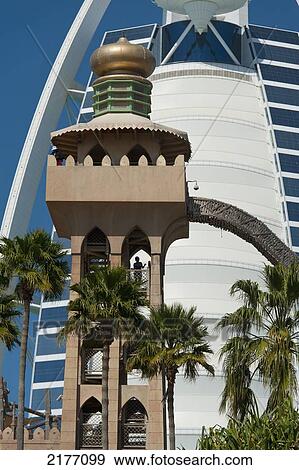 Stock Photo - UAE, Water slide at Wild Wadi waterpark in front of the Burj Al Arab Hotel; Dubai. Fotosearch