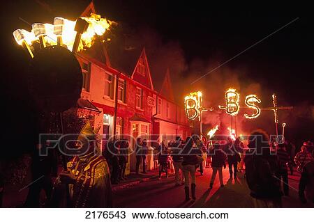 Stock Image - UK, Archbishop leading procession from Barcombe Bonfire Society through village; East Sussex. Fotosearch
