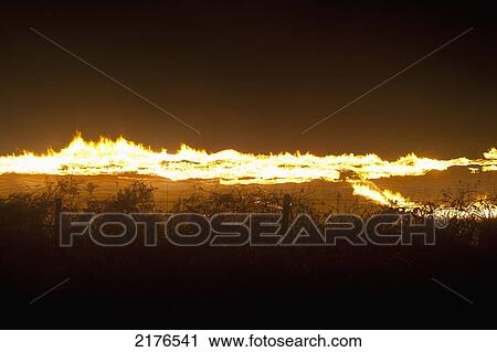UK, Barcombe Bonfire Night; East Sussex, Long exposure of people with burning torches going along lane View Large Photo Image Stock Image - UK, Barcombe Bonfire Night; East Sussex, Long exposure of people with burning torches going along lane. Fotosearch