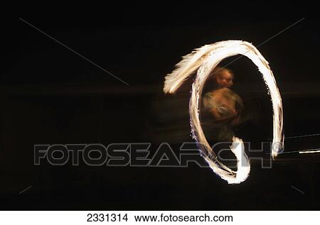 UK, Berkshire, Man juggling fire at night; Reading View Large Photo Image Picture - UK, Berkshire, Man juggling fire at night; Reading. Fotosearch