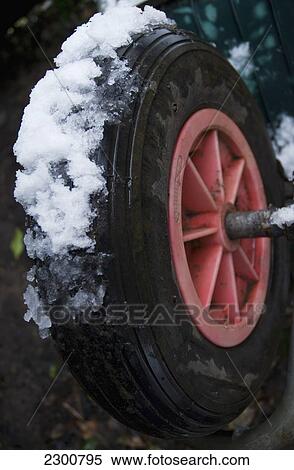 Stock Photography - Uk, Close Up; London, Snow Covered Wheelbarrow. Fotosearch