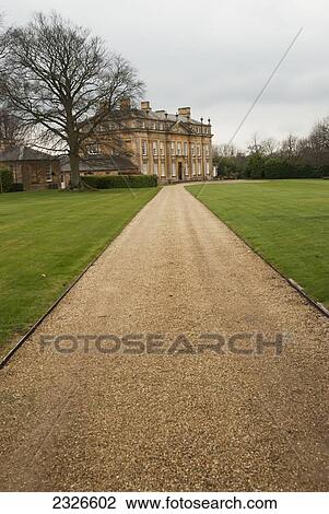 Stock Image - UK, Cotswolds, entrance gravel path; Ilmington, Foxcote house. Fotosearch