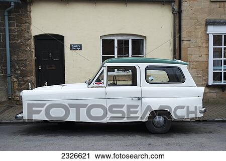 UK, Cotswolds, North Cotswolds, Three wheeler car in front of cottage; Chipping Campden View Large Photo Image Stock Image - UK, Cotswolds, North Cotswolds, Three wheeler car in front of cottage; Chipping Campden. Fotosearch