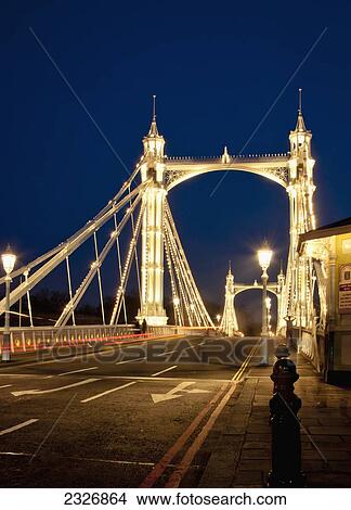 Picture - UK, England, Albert Bridge at night; London. Fotosearch