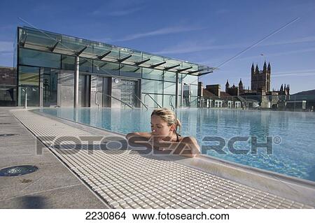 Uk, England, Bath Abbey In Background; Bath, Young Woman Relaxing In Roof Top Pool At Thermae Bath Spa View Large Photo Image Picture - Uk, England, Bath Abbey In Background; Bath, Young Woman Relaxing In Roof Top Pool At Thermae Bath Spa. Fotosearch
