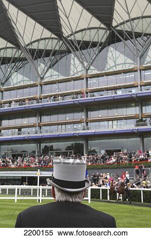 Uk, England, Berkshire, Top-Hatted Gentleman Viewing Horses In The Parade Ring With New Enclosure Stand; Ascot View Large Photo Image Stock Photography - Uk, England, Berkshire, Top-Hatted Gentleman Viewing Horses In The Parade Ring With New Enclosure Stand; Ascot. Fotosearch