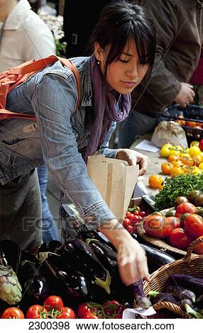 UK, England, Borough Market; London, Young woman shopping View Large Photo Image Stock Photo - UK, England, Borough Market; London, Young woman shopping. Fotosearch