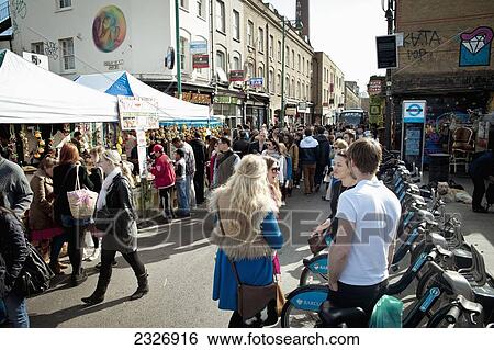Stock Photograph - UK, England, Brick Lane on busy and sunny Sunday; London. Fotosearch
