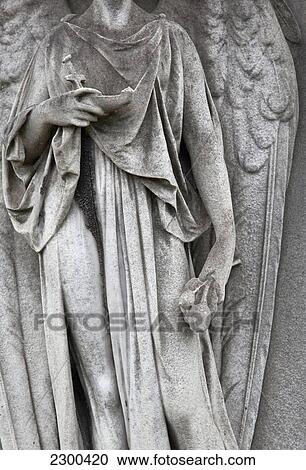 Stock Image - UK, England, Brompton Cemetery; London, Detail of angel figurehead. Fotosearch
