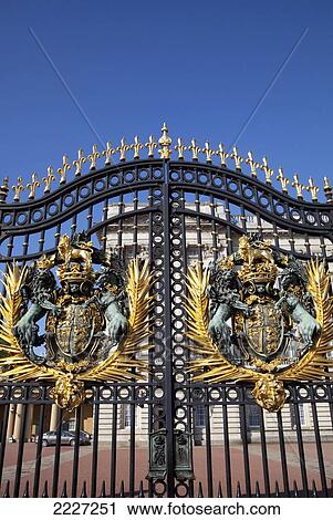 Stock Image - UK, England, Buckingham Palace Gates featuring Royal Coat of Arms; London. Fotosearch