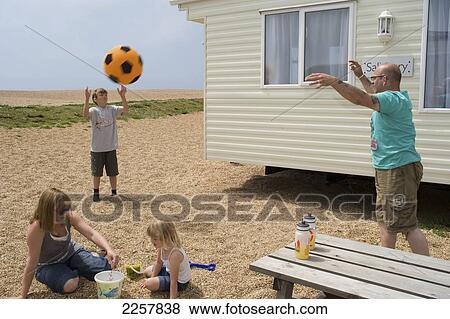 Uk, England, Dorset, Family On Caravan Holiday At Freshwater Beach Holiday Park; Jurassic Coast View Large Photo Image Stock Photo - Uk, England, Dorset, Family On Caravan Holiday At Freshwater Beach Holiday Park; Jurassic Coast. Fotosearch