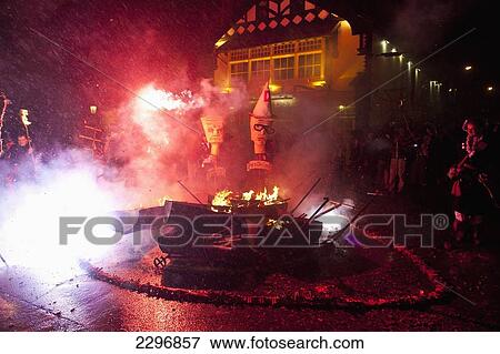 Stock Photo - UK, England, East Sussex, Bonfire night; Lewes, Letting off long line of crackers. Fotosearch