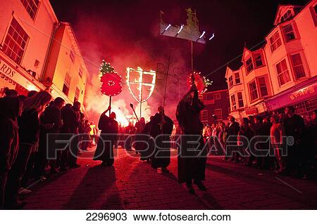 Stock Image - UK, England, East Sussex, People dressed as monks from Southover Bonfire Society lead Grand Procession through streets of Lewes on Bonfire night; Lewes. Fotosearch