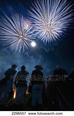 Stock Photo - UK, England, East Sussex, People watching fireworks at Nevill Junior Bonfire night; Lewes. Fotosearch