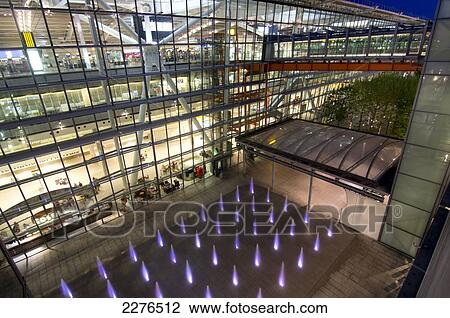 Stock Image - Uk, England, Heathrow Airport Terminal 5 Building Dusk.. Fotosearch