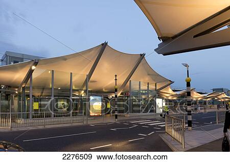 Stock Photo - Uk, England, Heathrow Airport Terminal 5 Building Dusk.. Fotosearch