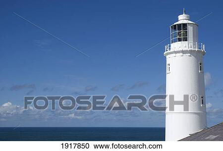 Stock Image - UK, England, Lighthouse and Blue Sky; Cornwall. Fotosearch