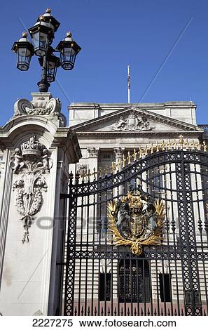Stock Photography - UK, England, London, Buckingham Palace Gates featuring the Royal Coat of Arms. Fotosearch