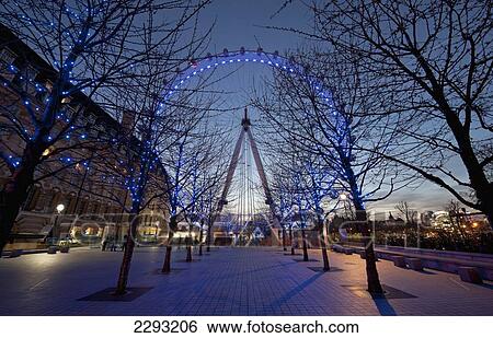 Stock Photograph - UK, England, London Eye at dusk; London. Fotosearch