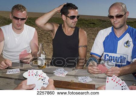 Uk, England, Man Playing Cards In Freshwater Beach Holiday Park On Jurassic Coast; Dorset View Large Photo Image Stock Image - Uk, England, Man Playing Cards In Freshwater Beach Holiday Park On Jurassic Coast; Dorset. Fotosearch