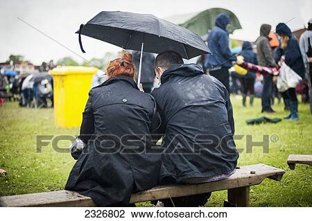 Stock Image - UK, England, Midland Railway; Derbyshire, Rainy day at Indietracks Festival. Fotosearch