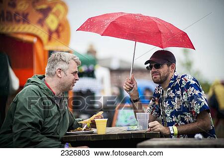 Stock Image - UK, England, Midland Railway; Derbyshire, Rainy day at Indietracks Festival. Fotosearch