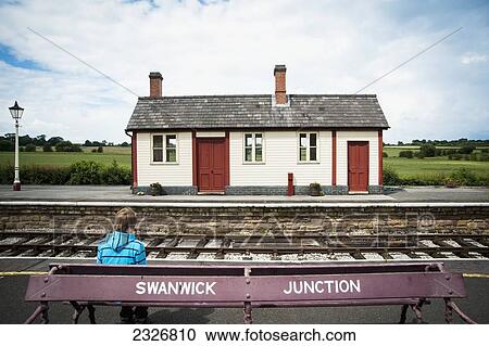 UK, England, Midland Railway; Derbyshire, Boy waiting at Swanwick Junction View Large Photo Image Stock Image - UK, England, Midland Railway; Derbyshire, Boy waiting at Swanwick Junction. Fotosearch