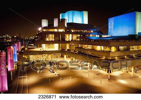 Stock Image - UK, England, National Theatre at night; London. Fotosearch