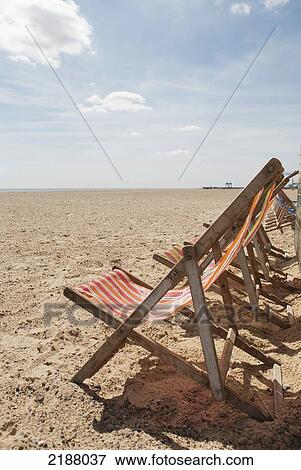 Stock Photo - Uk, England, Norfolk, Deckchairs On Beach; Great Yarmouth. Fotosearch