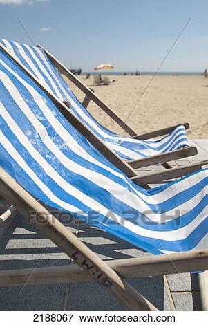 Stock Photo - Uk, England, Norfolk, Deckchairs On Promenade; Great Yarmouth. Fotosearch
