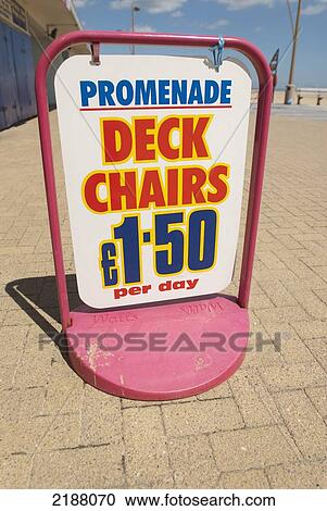 Stock Image - Uk, England, Norfolk, Sign For Deckchair Hire On Promenade; Great Yarmouth. Fotosearch