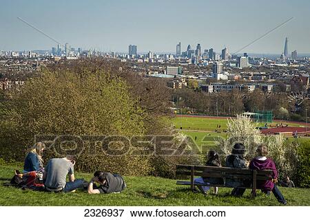 UK, England, North London; London, People enjoying London's skyline from Primrose Hill in Hampstead View Large Photo Image Stock Photo - UK, England, North London; London, People enjoying London's skyline from Primrose Hill in Hampstead. Fotosearch