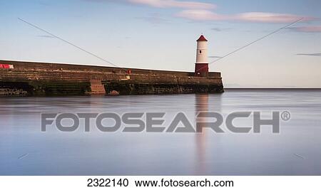Stock Image - UK, England, Northumberland, Berwick, Lighthouse at edge of pier. Fotosearch