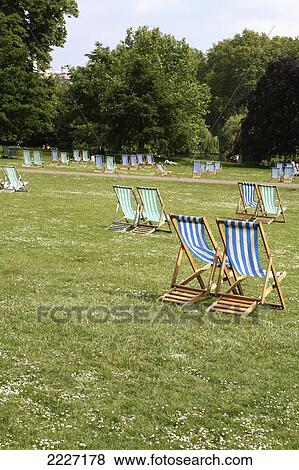 UK, England, one of Royal Parks of London; Westminster London, Deck chairs for hire in St James's Park View Large Photo Image Stock Photo - UK, England, one of Royal Parks of London; Westminster London, Deck chairs for hire in St James's Park. Fotosearch