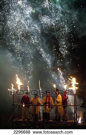 UK, England, People dressed as clergy on stand with fireworks behind them at Newick bonfire night; East Sussex View Large Photo Image Stock Photo - UK, England, People dressed as clergy on stand with fireworks behind them at Newick bonfire night; East Sussex. Fotosearch