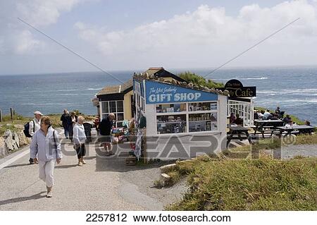Stock Image - Uk, England, People Relaxing At Lizard Point; Cornwall. Fotosearch