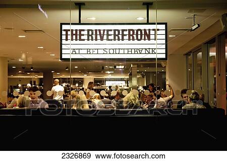 Stock Photo - UK, England, Riverfront cafe and restaurant at BFI; London. Fotosearch