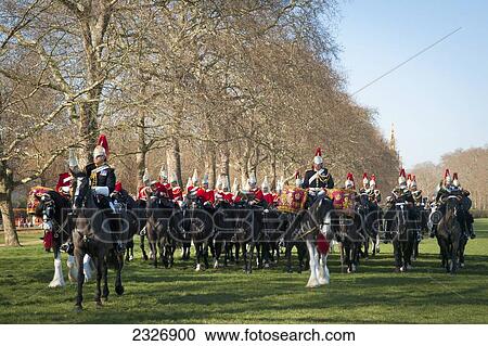 Stock Image - UK, England, Royal Guards rehearsing in Hyde Park; London. Fotosearch