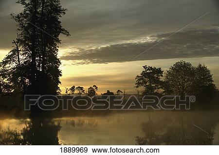 UK, England, Summer Sunrise On Small Pond In The Country; Kent View Large Photo Image Stock Photo - UK, England, Summer Sunrise On Small Pond In The Country; Kent. Fotosearch