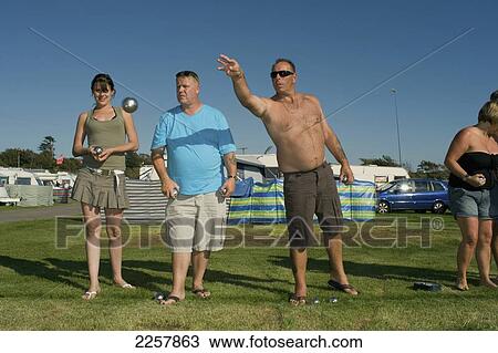 Stock Image - Uk, England, View Of People Playing Boule In Freshwater Beach Holiday Park On Jurassic Coast; Dorset. Fotosearch